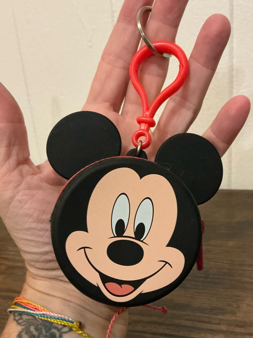 A rare Disney Parks Mickey Mouse silicon coin purse keychain